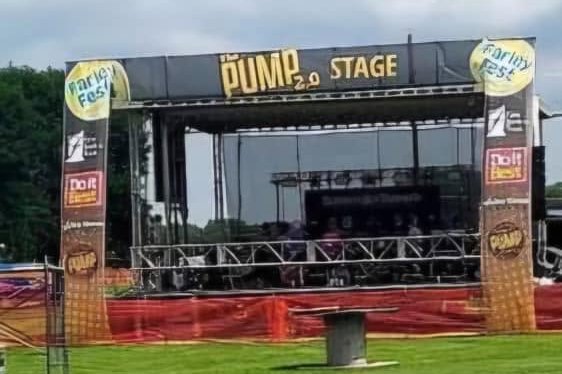 The Pump 2.0 Stage, an outdoor festival stage with Farley Fest banners